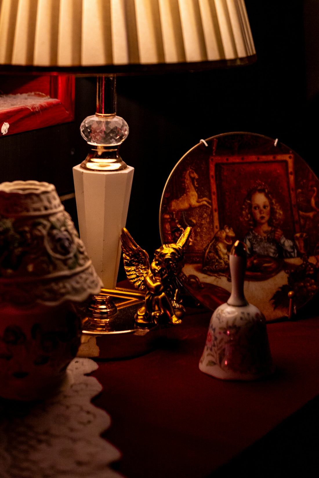 Decorative objects on a table with a lamp