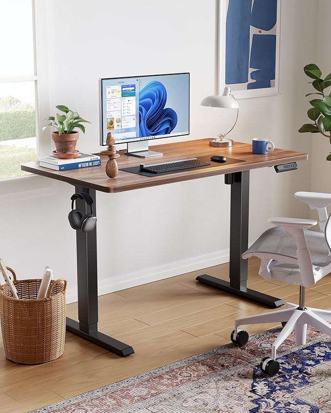 HUANUO 48" x 24" Electric Standing Desk Adjustable Height, 4 Memory Height Settings, Headphone Hook, Cable Manager, Sit Stand Up Desk for Home Office & Computer Workstation, Walnut