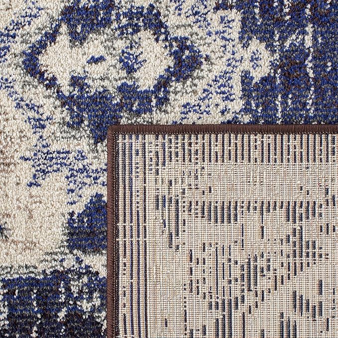 SAFAVIEH Monaco Collection Area Rug - 5'1" x 7'7", Ivory & Navy, Boho Chic Medallion Distressed Design, Non-Shedding & Easy Care, Ideal for High Traffic Areas in Living Room, Bedroom (MNC243C)